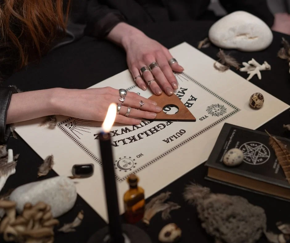 A Ouija board with its planchette