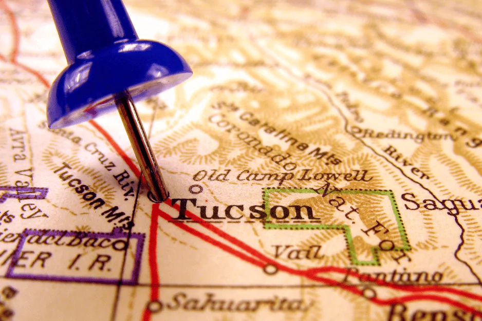 Blue pushpin marking Tucson on a vintage Arizona map