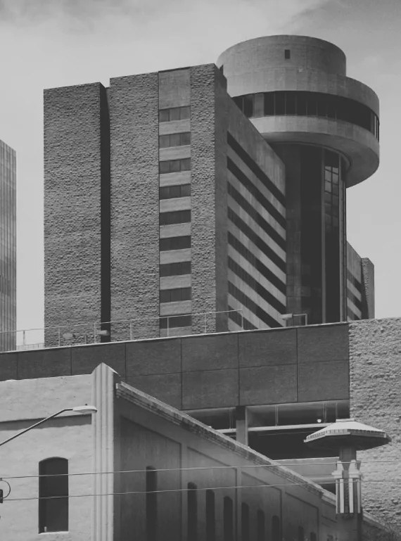 Downtown Phoenix towers rising behind an older brick building