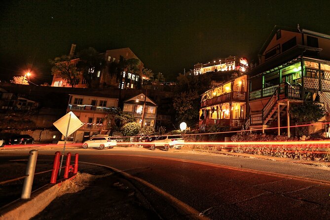 Guided ghost walk past historic buildings in Jerome