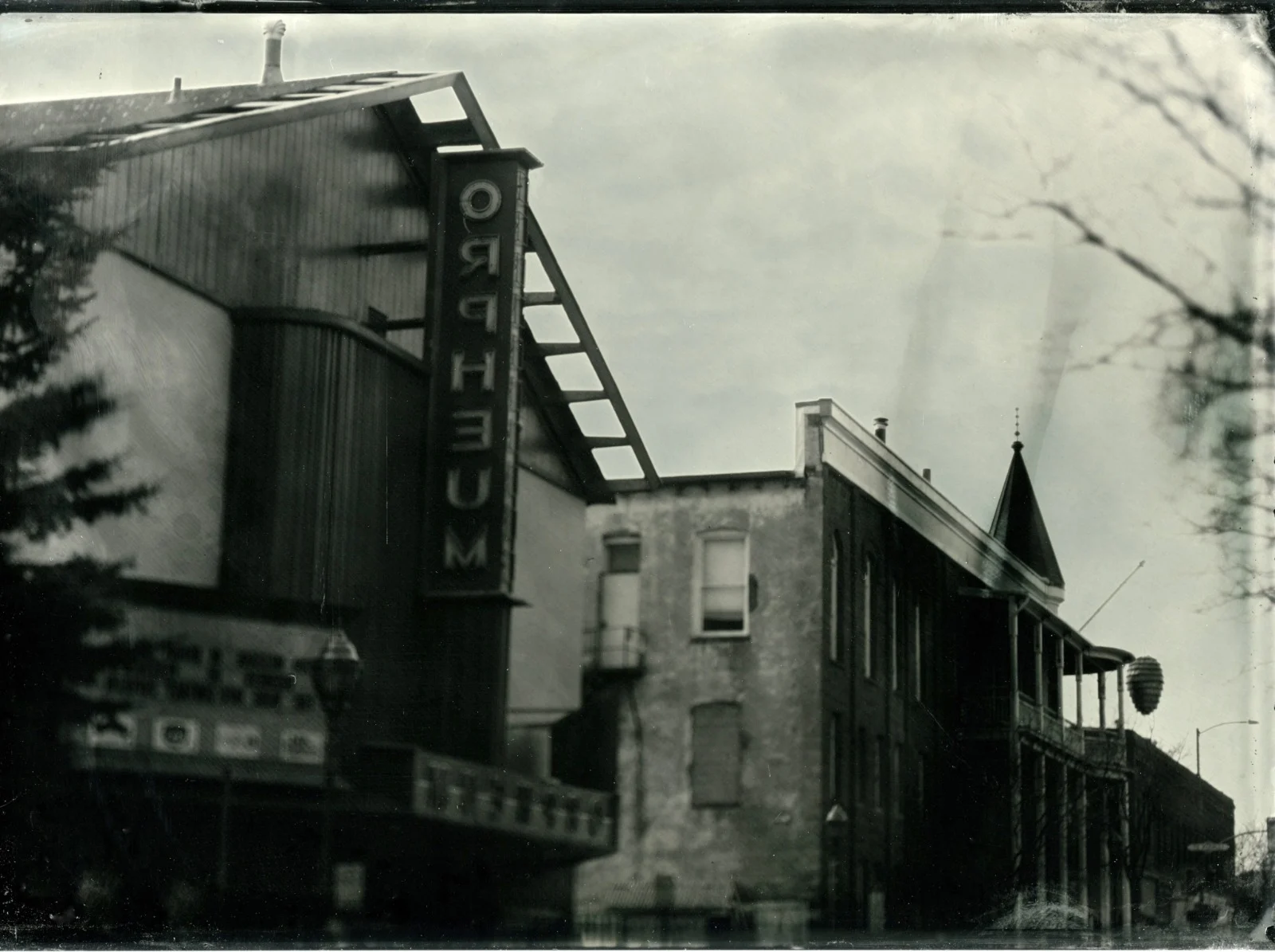 Vintage black and white view of the vertical Orpheum theater marquee in Flagstaff