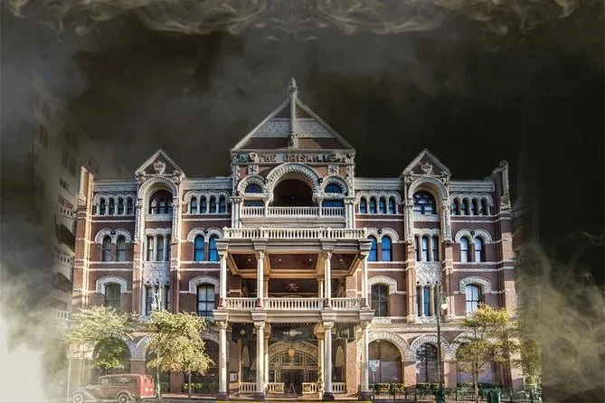 The Driskill Hotel, an ornate Victorian building, wreathed in dark smoke