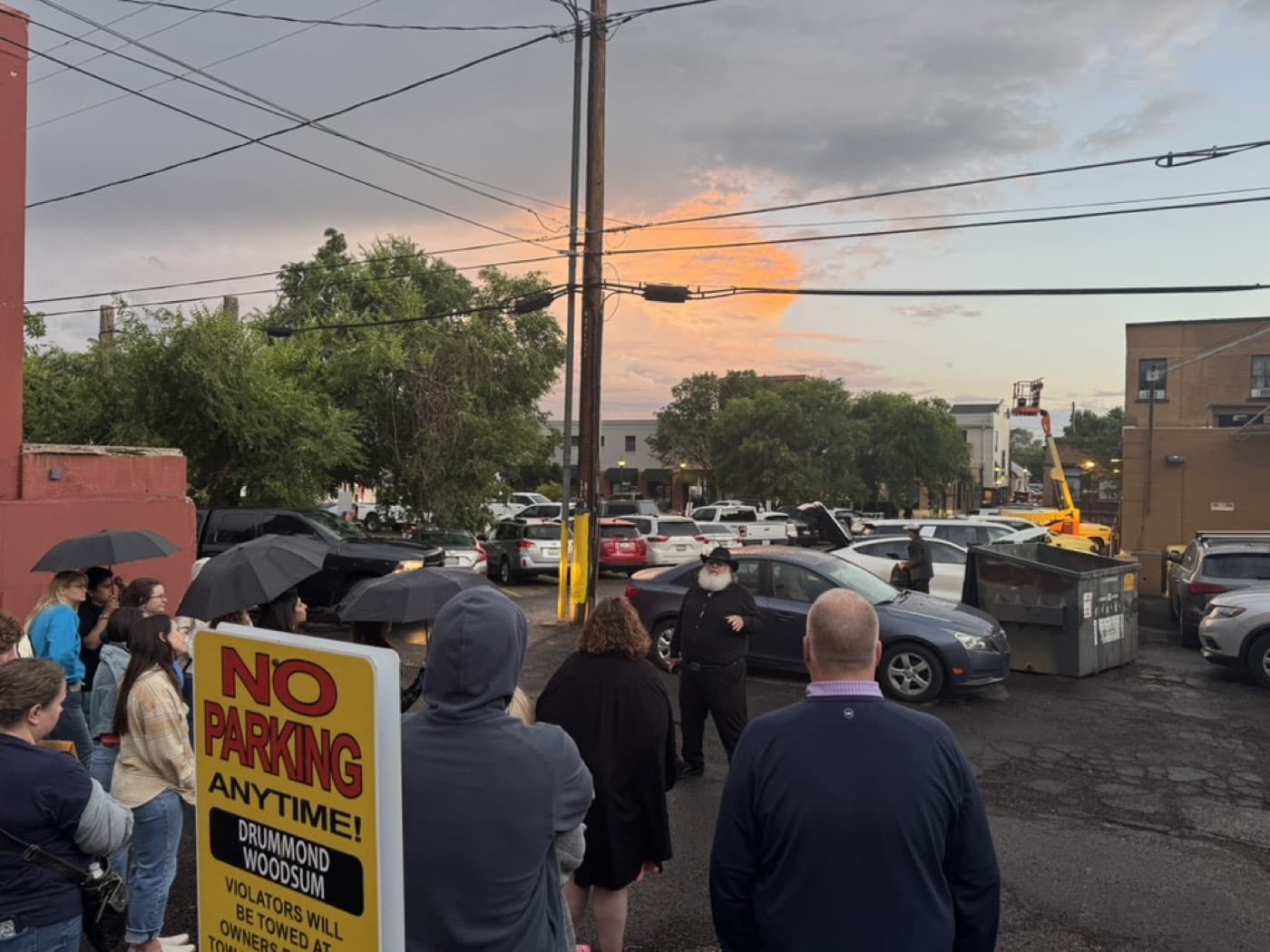Behind downtown's storefronts, our storyteller shares the alley lore visitors never find on their own while sunset burns through the storm.