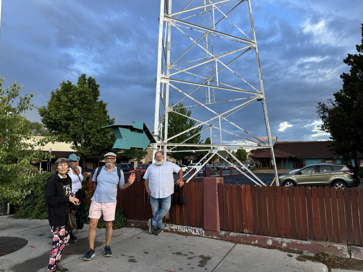 A quick wave under the Downtowner sign, one of northern Arizona's last great steel-lattice motel towers.