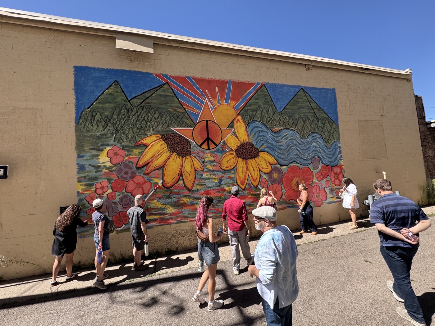 Michelangelo's David towers in paint beside the Orpheum block on one of downtown Flagstaff's largest murals.