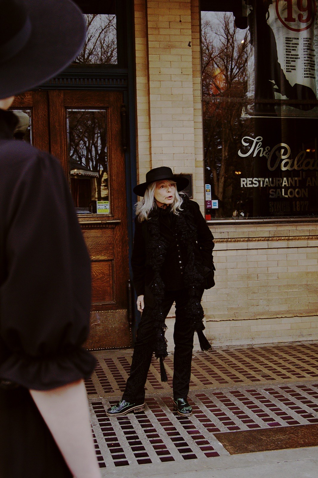 Stephanie, a Freaky Foot Tours guide, in the doorway of the Palace Saloon in Prescott