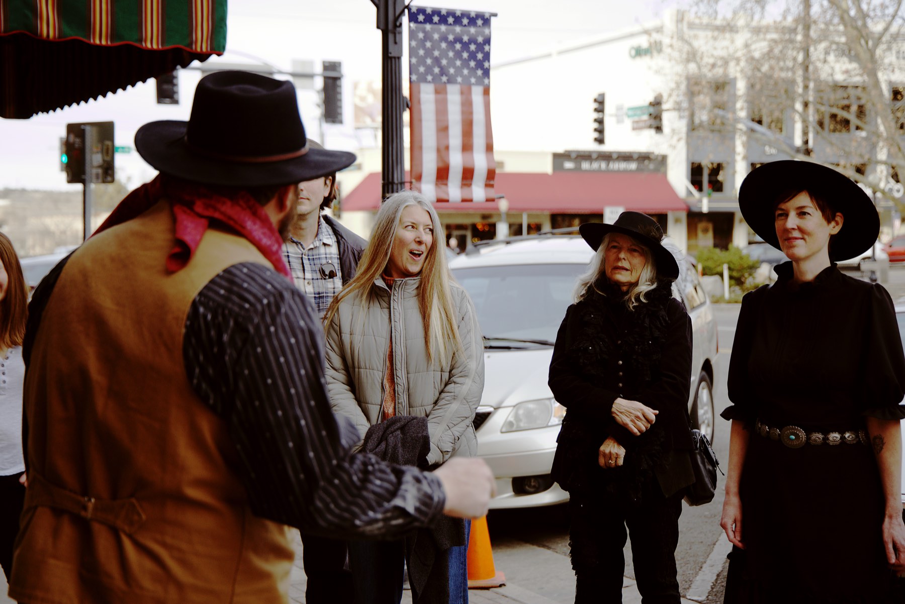 A Freaky Foot Tours guide sharing a laugh with guests on Whiskey Row in downtown Prescott