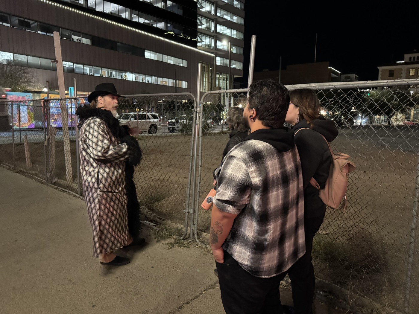 Guests at the vacant Santa Rita Hotel site on a night tour